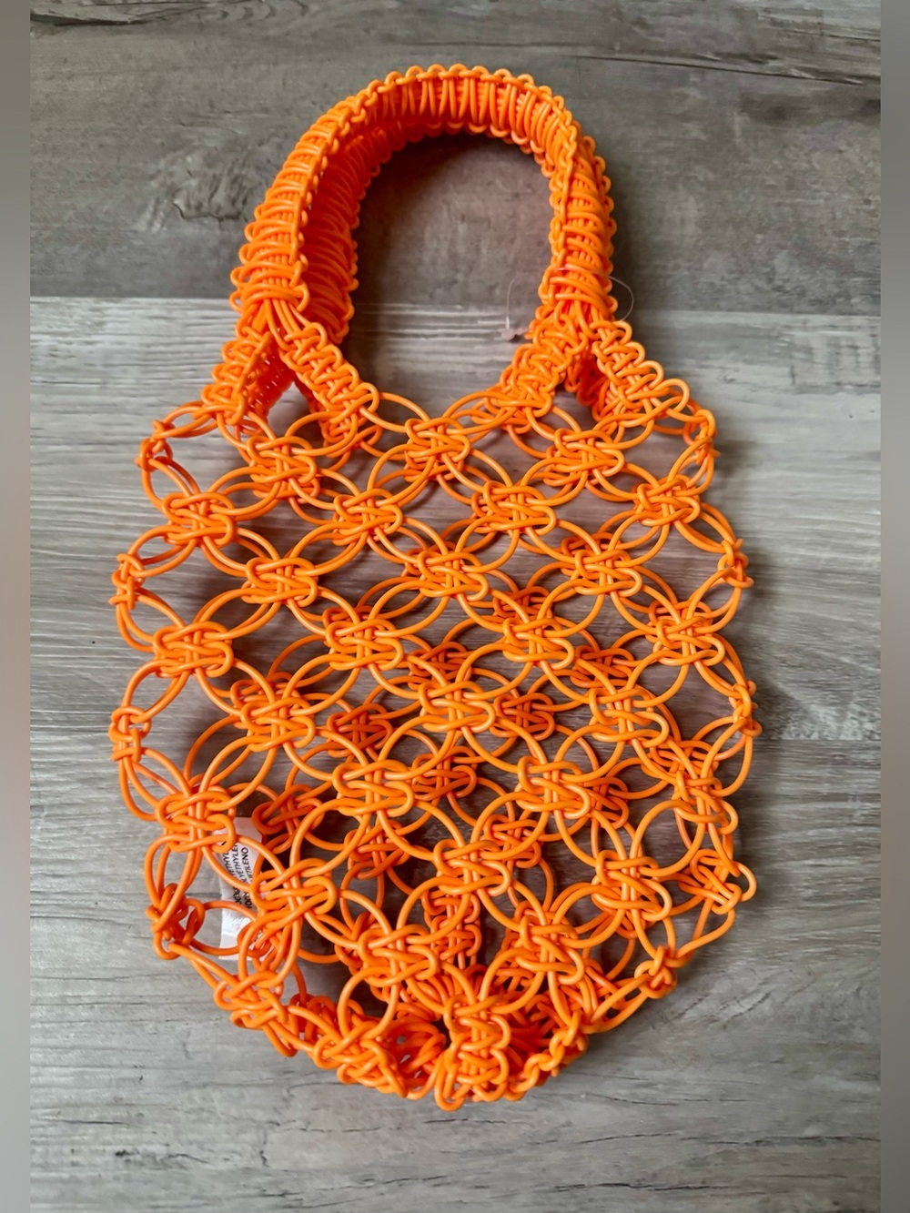 Urban Outfitters  A dream boho-style open-weave bag. Petite size, perfect for ca